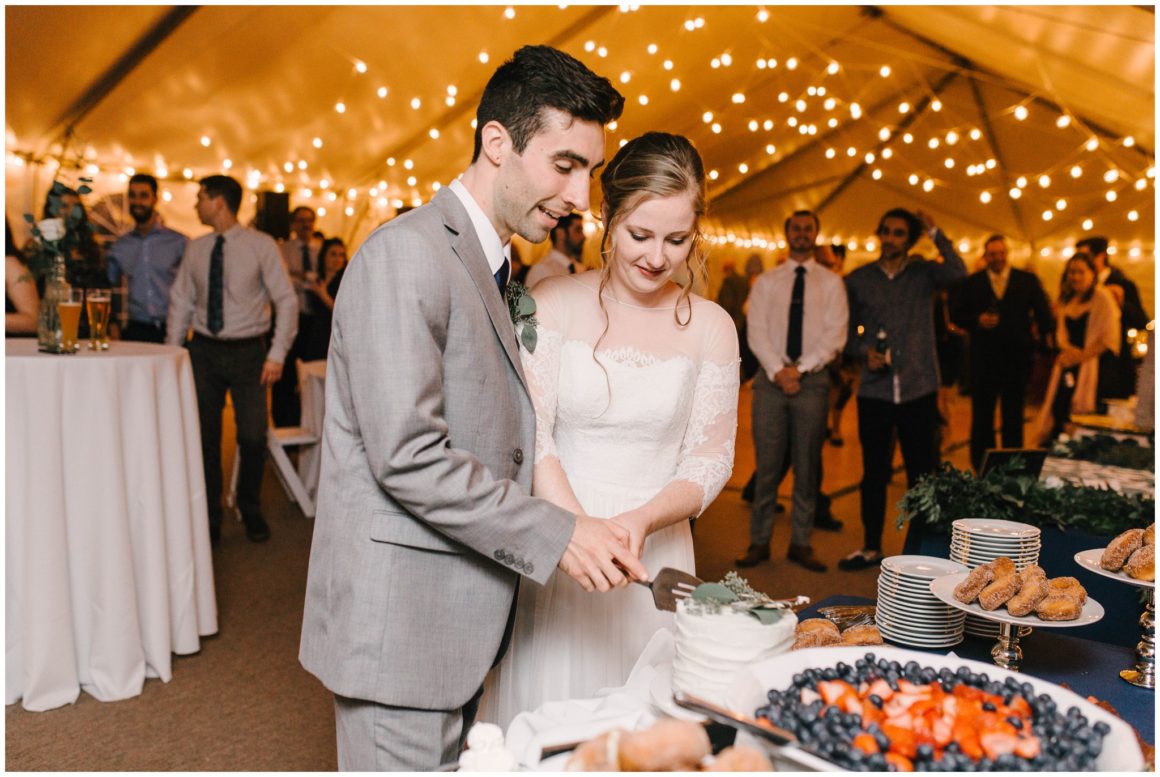 bride and groom cutting cake at graeme park wedding