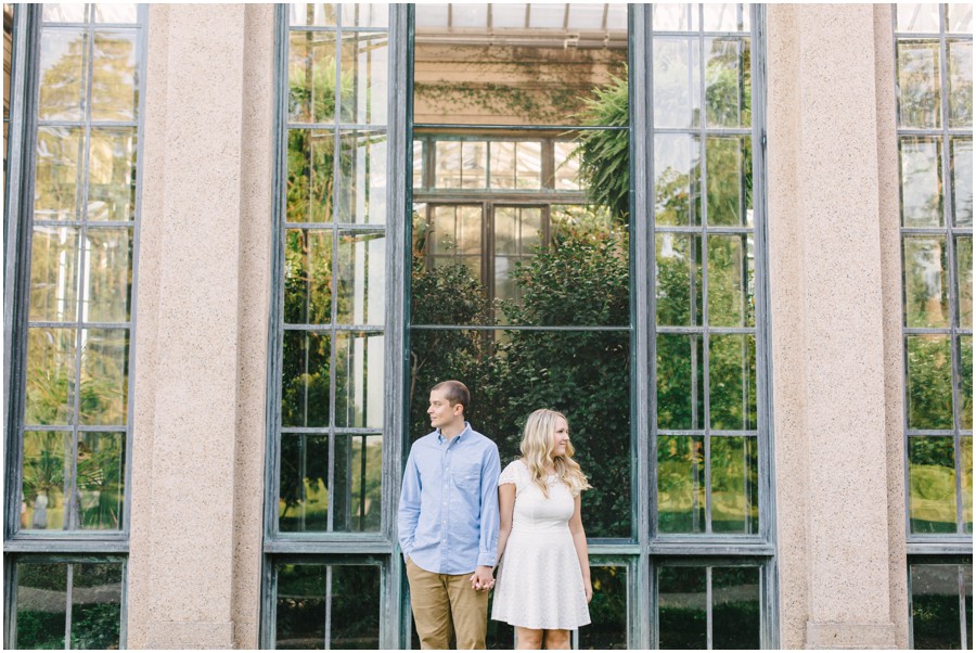 couple looking opposite directions at longwood garden during engagement