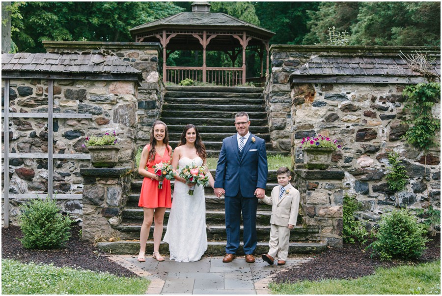 family standing side by side at ridley creek state park