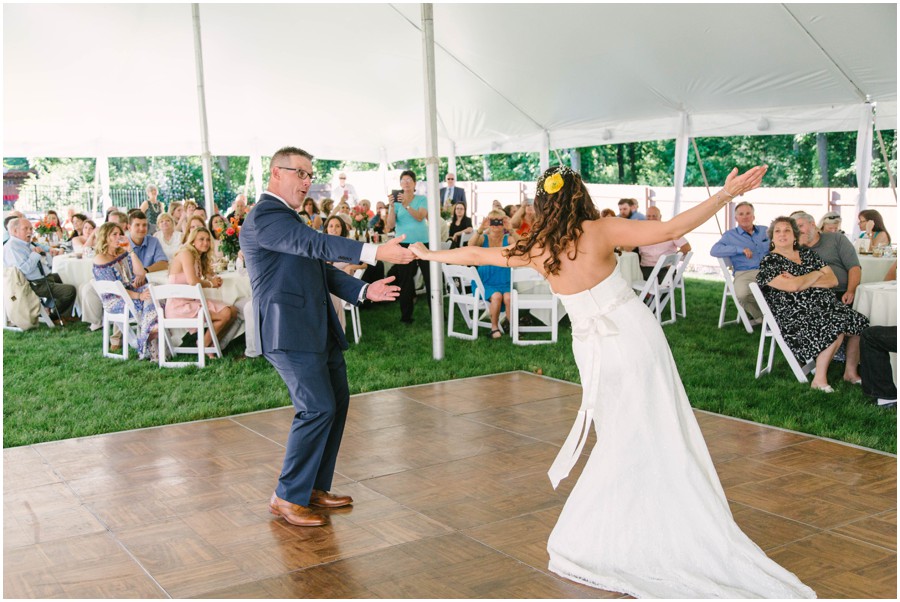 bride and groom dancing during first dance at backyard wedding