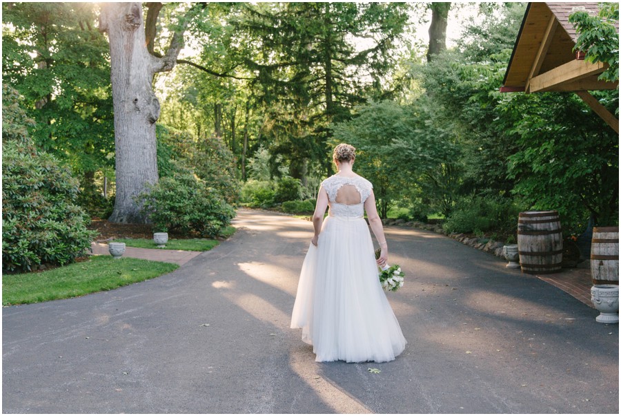 bride walking on path at meredith manor