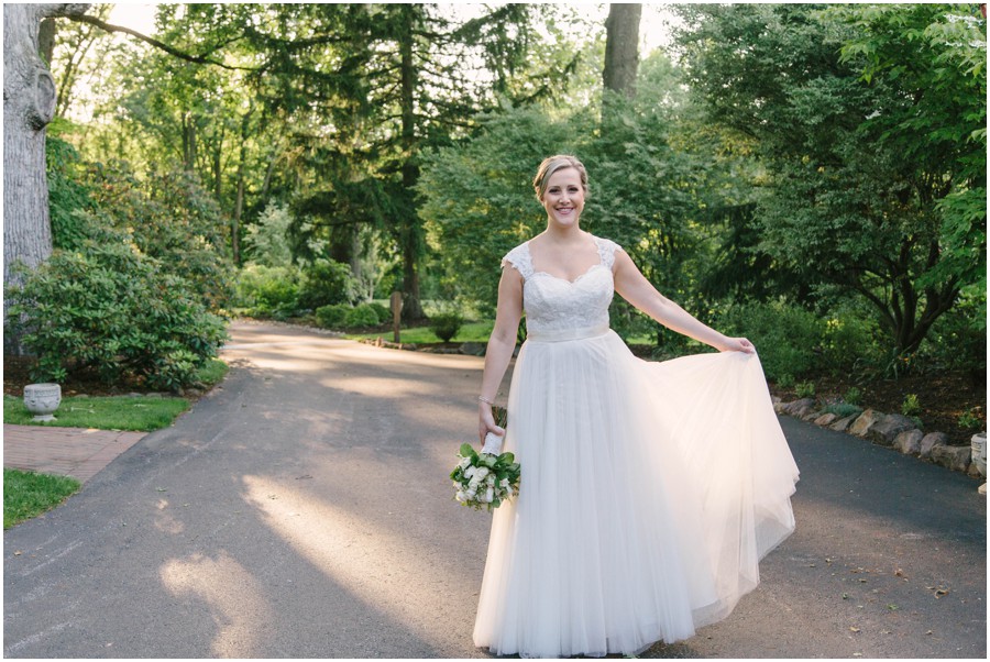 bride holding dress at meredith manor
