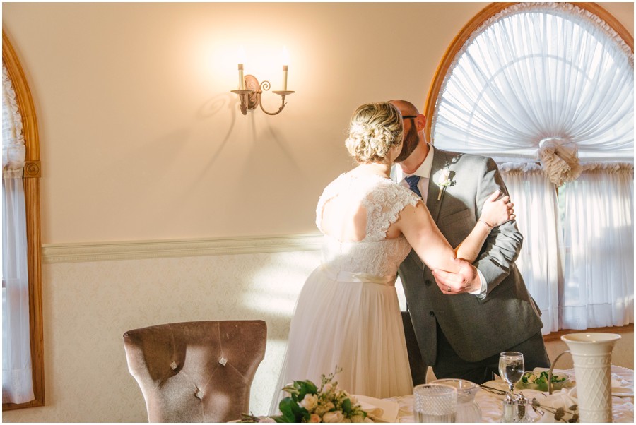 bride and groom at reception kissing at meredith manor