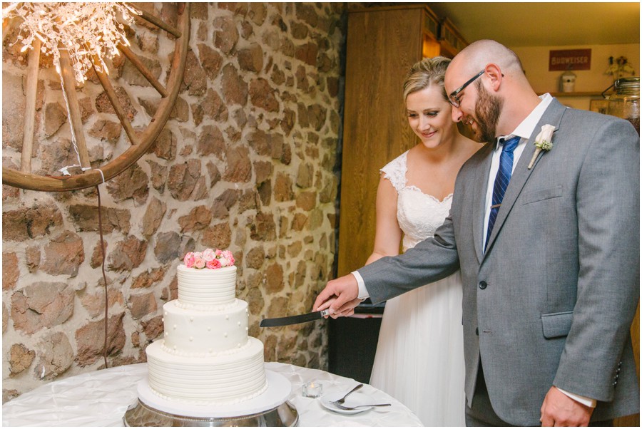 bride and groom cutting cake at meredith manor