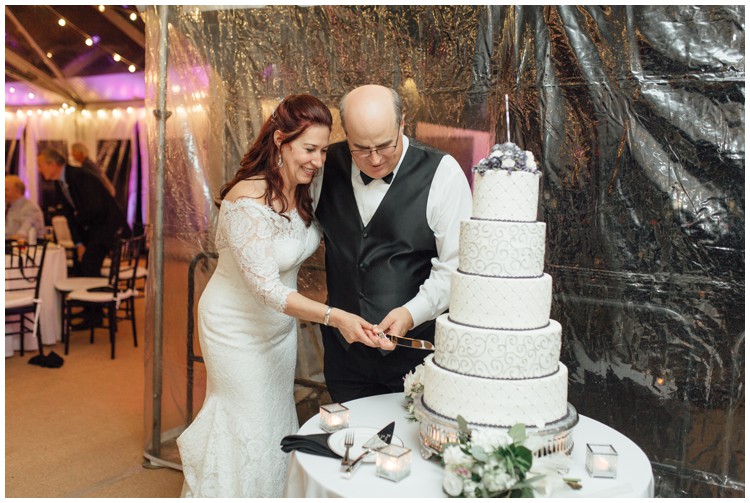 couple cutting masters baker cake at loch aerie mansion wedding frazer pa